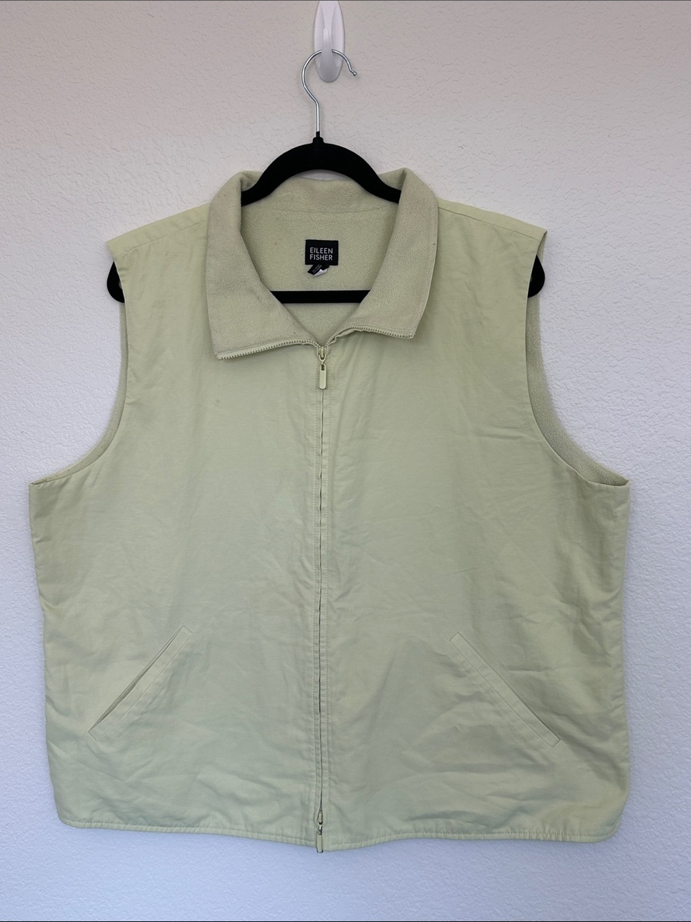 Eileen Fisher pale green vest featuring a full zip front